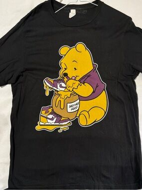 Black Short-Sleeve Tee with Yellow Pooh Graphic and Purple Accents